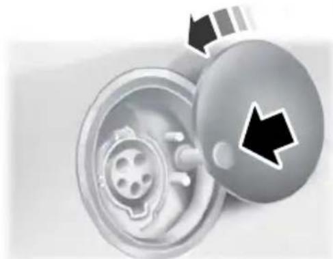 Close-up of a car wheel with a magnified inset showing the engine and wheel (no text or symbols visible)
