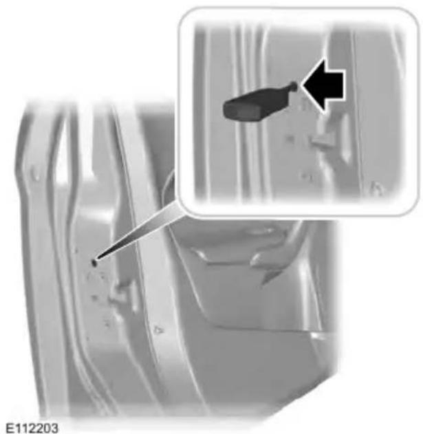 Close-up of a car interior with a screwdriver inserted, showing a close-up of the component (no text or symbols visible)