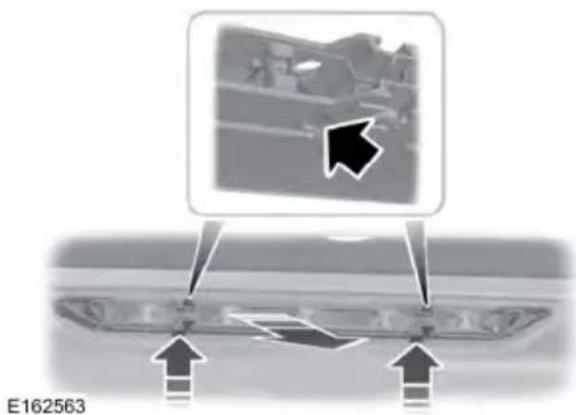 Diagram showing a vehicle interior with arrows indicating movement or force, no readable text or symbols present.