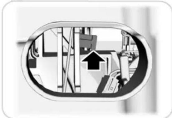 Diagram showing a mechanical or industrial interior with an arrow pointing to a component, enclosed in an oval frame (no text or symbols)