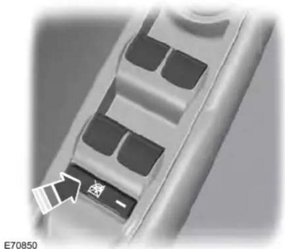 Close-up of a control panel with buttons and an arrow pointing to it (no readable text or symbols)