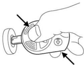 Line drawing of a hand holding a remote control device with buttons and dials (no text or symbols)