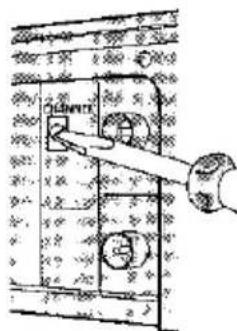 Technical diagram showing a hand operating a switch labeled 'INN' with circular components, likely illustrating a mechanical or electrical component assembly.