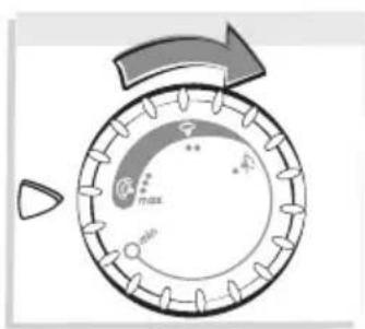Diagram showing a circular device with labeled components and directional arrow, likely illustrating a process or control mechanism.