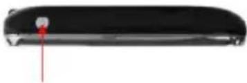 Close-up of a black cylindrical object with a small red mark and arrow pointing to its edge (no text or symbols visible)