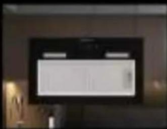 Interior view of a modern room with a large monitor displaying a white rectangular screen (no visible text or symbols)