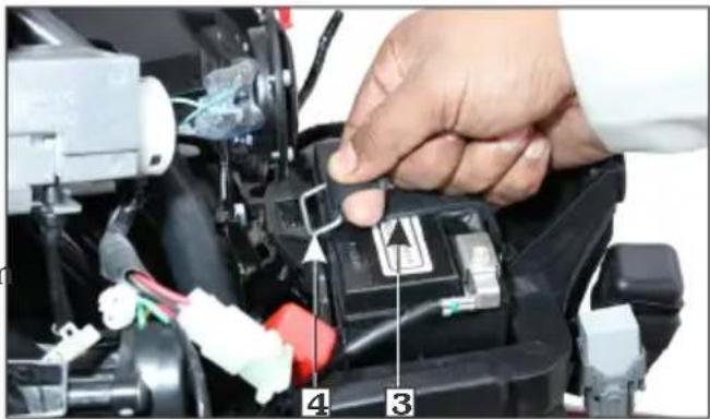 Close-up of a hand installing or adjusting a component with numbered parts labeled 3 and 4, showing wiring and assembly details.