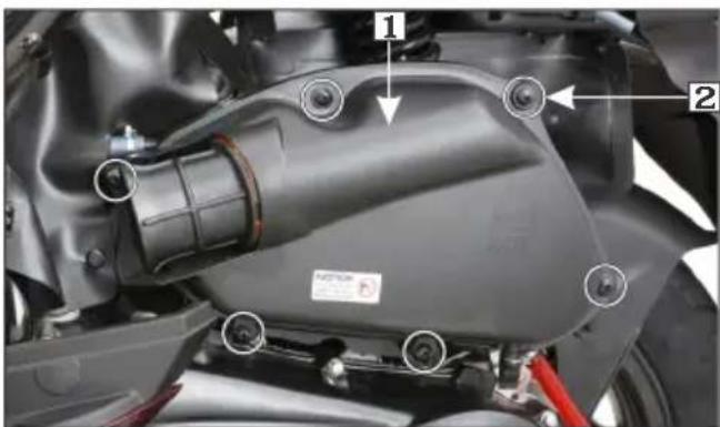 Labeled mechanical component diagram showing parts numbered 1 and 2 with annotations like 'MOTUS' and red rod.