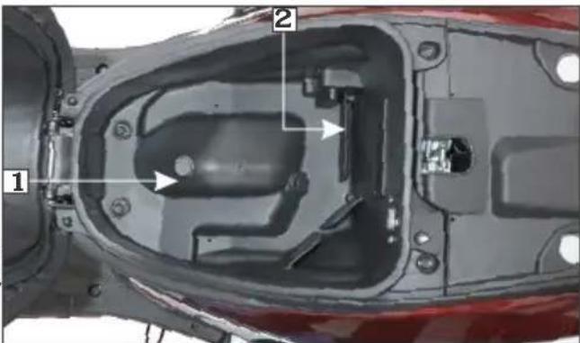 Technical diagram of a vehicle engine compartment with labeled parts 1 and 2