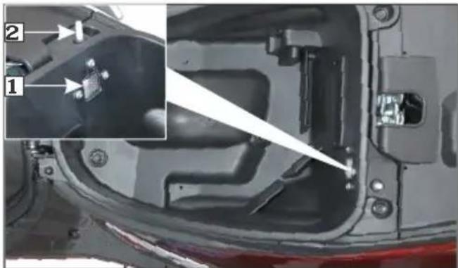 Technical diagram of a vehicle's internal components with numbered annotations and an inset showing a component detail.