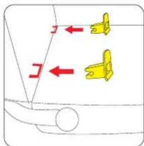 Diagram showing two yellow plastic clips with red directional arrows indicating movement or force directions on a vehicle surface.