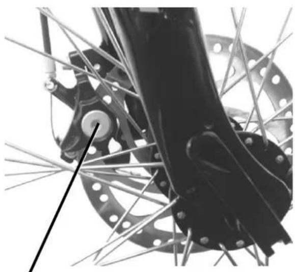 Close-up of a bicycle wheel assembly with visible stator and rotor blades (no text or symbols)
