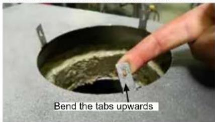 Bend the tabs upwards