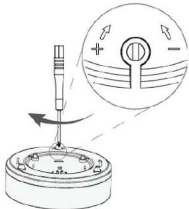 Diagram illustrating a mechanical or electrical component with directional arrows and a magnified circular view showing flow or force direction.