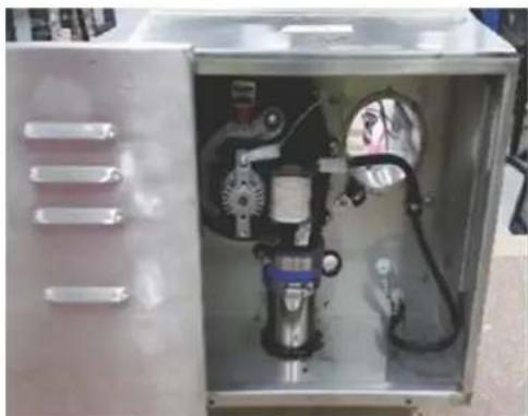 Interior view of an open industrial enclosure with visible internal components and wiring (no text or symbols)