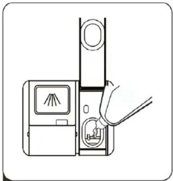 Line drawing of a hand inserting a device into a device with a screen and plug (no text or symbols)