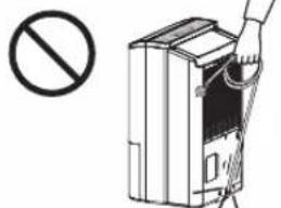 Diagram showing a hand inserting a device into a device with a prohibition symbol nearby