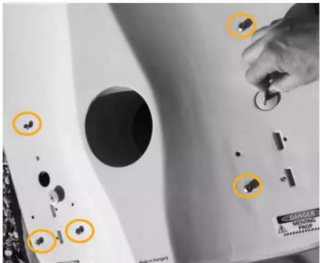 Photo of a door panel with labeled buttons and a hand adjusting the knob, showing Chinese text and warning labels.