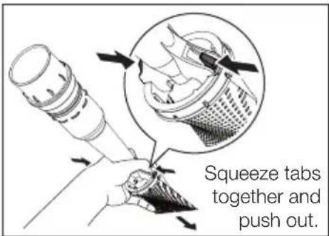 Squeeze tabs together and push out.