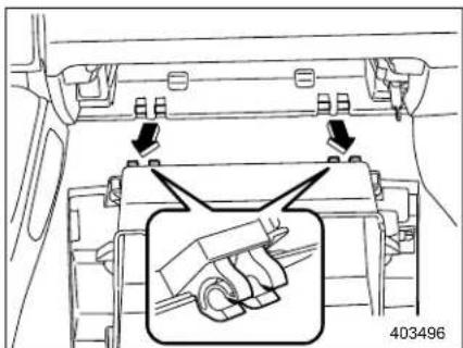 Diagram showing car interior components with arrows indicating adjustment or repair, and a magnified inset highlighting a hand tool.