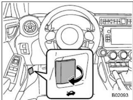 Diagram of car interior showing steering wheel, dashboard, and seatbelt with a magnified inset highlighting the seatbelt switch.