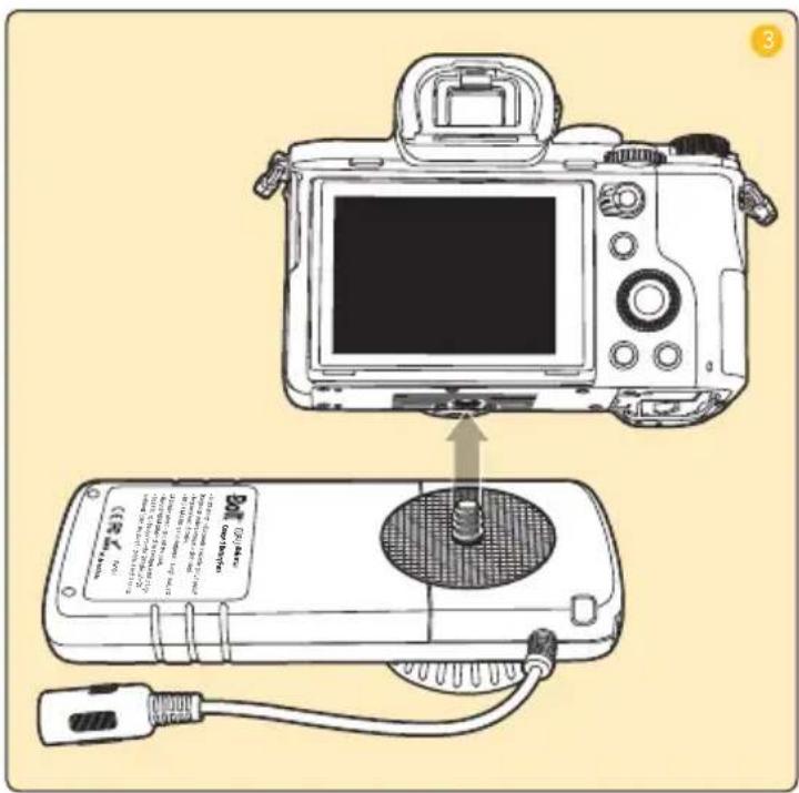 Diagram showing a DSLR camera connected to a handheld device with labeled components and a cable, illustrating the setup.