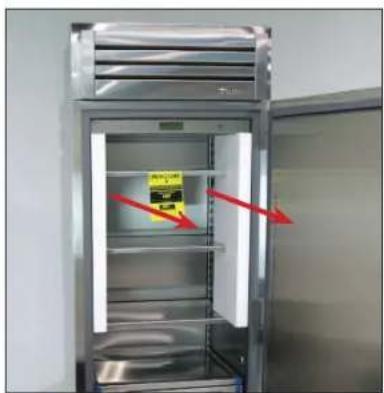 Photo of a refrigerator with visible warning labels and red arrows indicating safety or inspection points