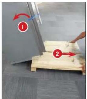 Instructional diagram showing two steps of fabric rolling on a wooden plank, labeled ① and ② with red arrows indicating rotation.