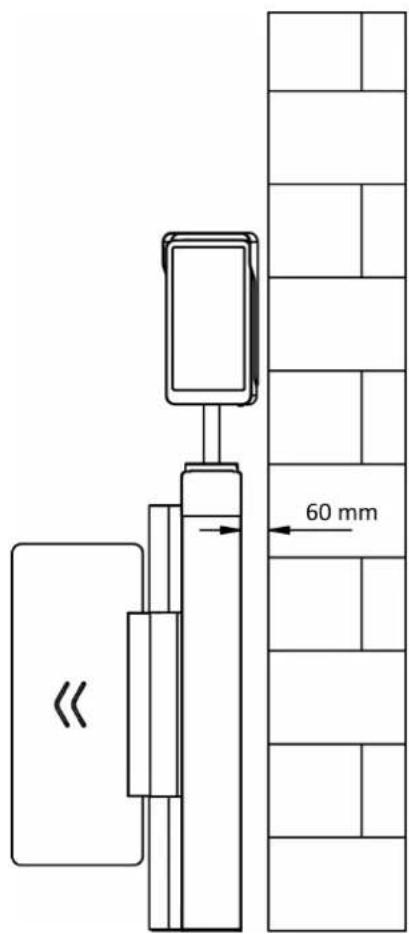 Technical diagram showing a mechanical device mounted on a wall with a 60 mm dimension标注 and directional arrow.