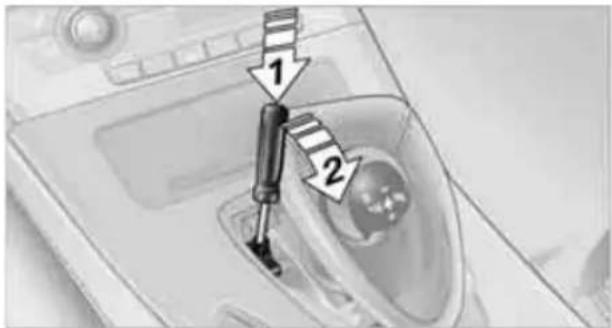 Diagram showing a device with labeled parts and directional arrows, likely illustrating a mechanical or fluid system component.