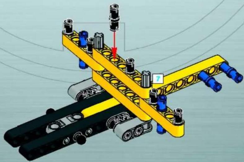 3D mechanical assembly diagram showing a yellow and black assembly with blue components and a red arrow indicating motion (no text or symbols)