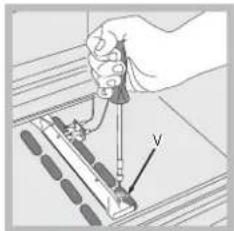 Illustration of a hand using a tool to interact with a device, labeled 'V' (no text or symbols beyond the label)