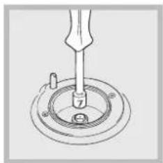 Technical line drawing of a mechanical assembly with a tool inserted into a circular component (no text or symbols)