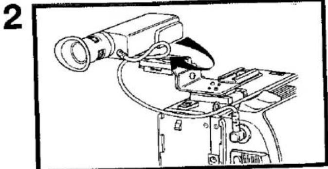Line drawing of a camera setup with lens and mounted device (no text or symbols)