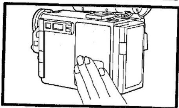 Line drawing of a handheld device with a hand interacting with the front panel (no text or symbols)