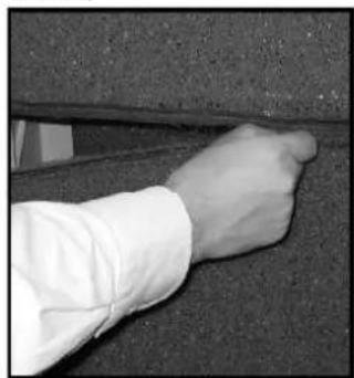Close-up of a hand touching a textured surface, no visible text or symbols