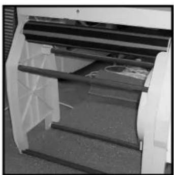 Close-up of a white industrial machine with transparent panels and internal structure (no visible text or symbols)