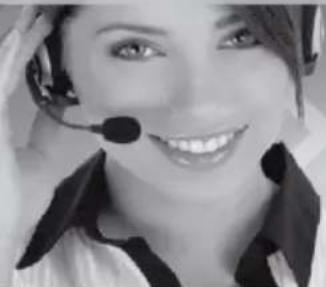 Close-up of a smiling woman wearing a headset and collared shirt (no visible text or symbols)