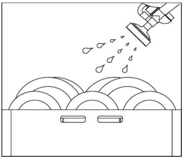 Line drawing of a showerhead spraying water onto a surface with circular patterns (no text or symbols)