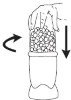 Hand holding a container filled with granular material, with arrows indicating rotation and downward motion (no text or symbols)
