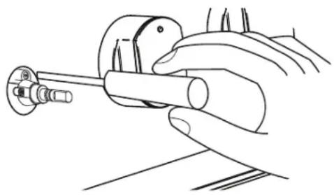 Line drawing of a hand holding a cylindrical tool with a knob, no text or symbols present