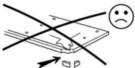 Diagram illustrating a safety or hazard warning with crossed lines, a sad face emoji, and an arrow pointing to a damaged object.