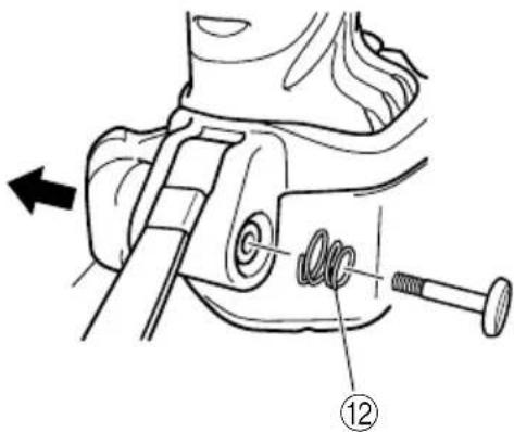 Technical diagram showing mechanical assembly with labeled parts and directional arrow