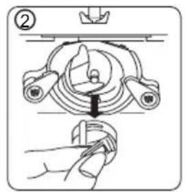 Technical diagram showing a mechanical assembly with labeled components and a hand holding a tool, likely illustrating a turning or disassembly process.