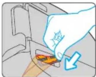 Illustration of a hand inserting a component into a device (no text or symbols visible)