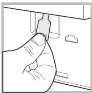 Line drawing of a hand inserting a plug into a device.