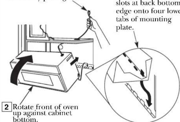 slots at back bottom edge onto four lower tabs of mounting plate. 2 Rotate front of oven up against cabinet bottom.