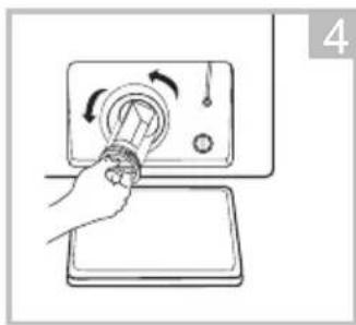 Hand holding a rotary knob on a control panel (no text or symbols visible)