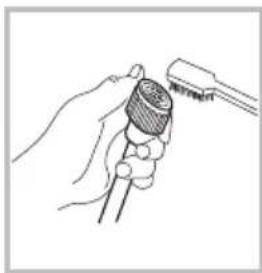 Line drawing of a hand holding a microphone with a tool inserted (no text or symbols)