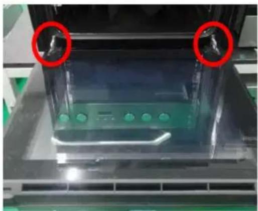 Close-up of a transparent electronic device with green components and red circular annotations (no readable text or symbols)